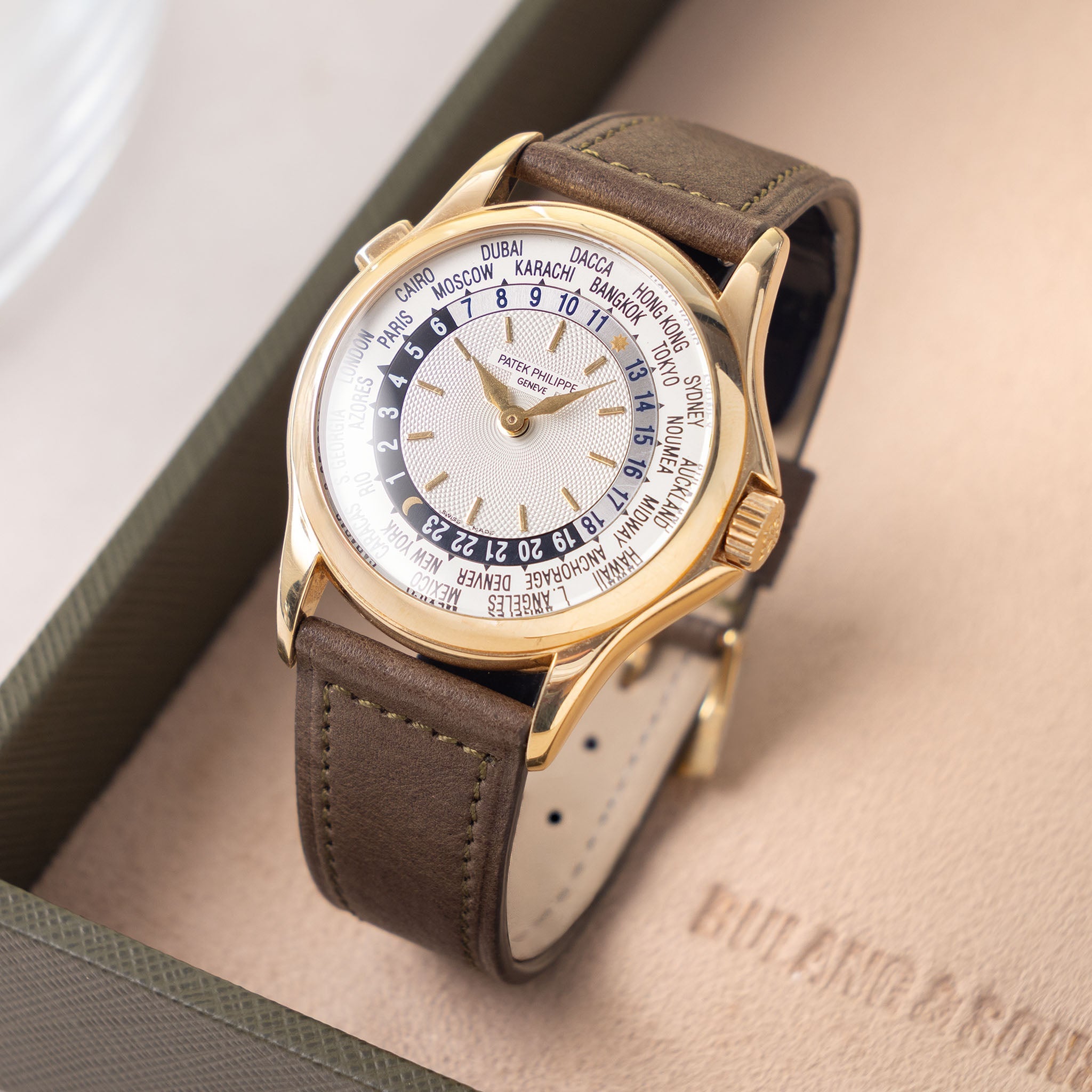 Patek Philippe World Time 5110J Guilloche Dial in 18k Yellow Gold with Extract of the Archives