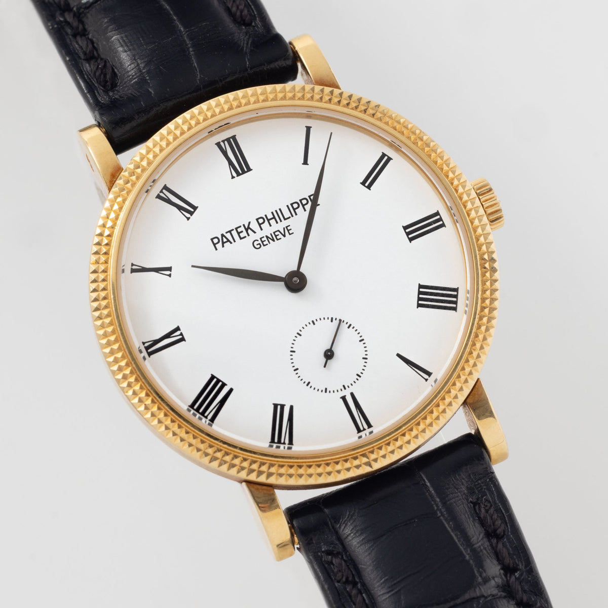 Patek Philippe Calatrava Ref 7119J 18k Yellow Gold Clous de Paris with White Roman Dial