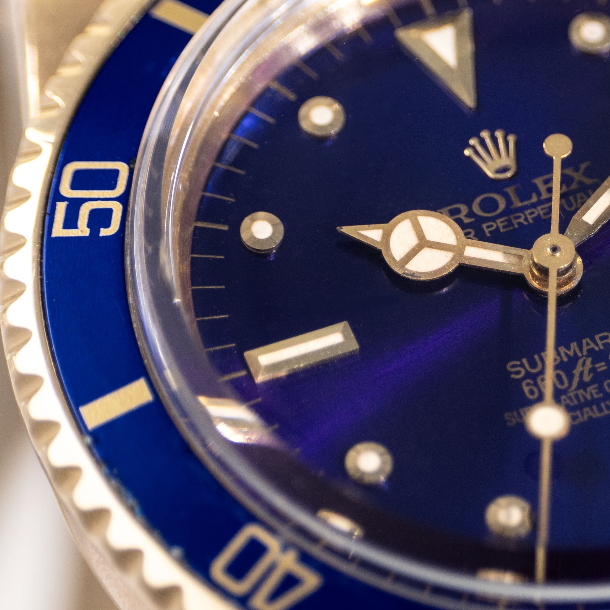 Rolex Submariner 1680/8 in 18k Yellow Gold with Blue "Nipple" Dial Turned Purple