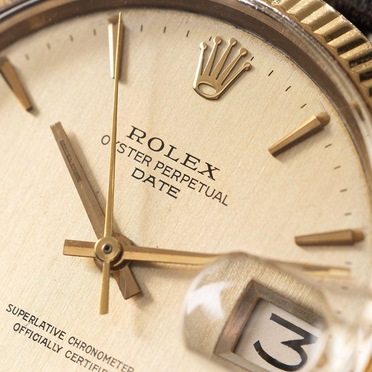 Rolex Oyster Perpetual Date 1503 in 18k Yellow Gold Vertical Brushed Champagne Dial