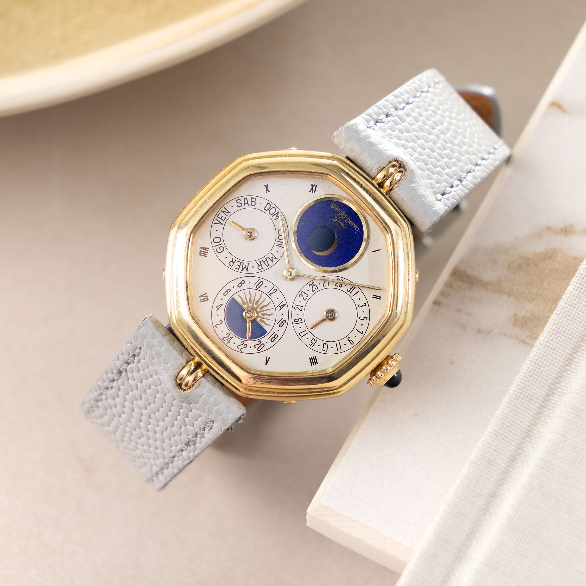 Gerald Genta “Succes “ Day date calendar moonphase with cream dial in 18 k yellow gold ref G2747